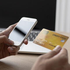 Businessman use mobile phones to register for security Online with a credit card to buy products online through application,Online shopping or Internet technology concept.