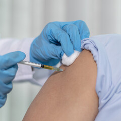 Doctor is vaccinating the patient with antibiotics or virus-resistant antibiotics to prevent the spread of the virus, Antibiotics prevent new strain of flu concept.