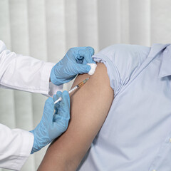 Doctor is vaccinating the patient with antibiotics or virus-resistant antibiotics to prevent the...