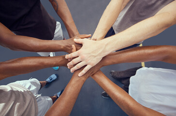 Teamwork, solidarity and diversity sports people hands stacked together from above. Athlete group...
