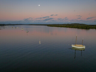 Fototapeta premium Sunset over the river with boats