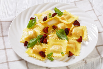 italian ravioli with chorizo ricotta filling on plate