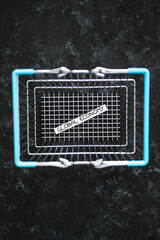 empty shopping basket with global economy text inside, recovery or recession after the pandemic