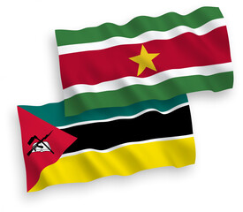 Flags of Republic of Mozambique and Republic of Suriname on a white background