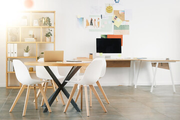 Office interior design, workspace building and desk table with wood chairs. Industrial professional room, concrete floor and white wall paint. Idea style storyboard, modern computer and empty decor
