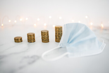 increase in prices and inflation after the pandemic, stacks of coins lined up from smaller to...