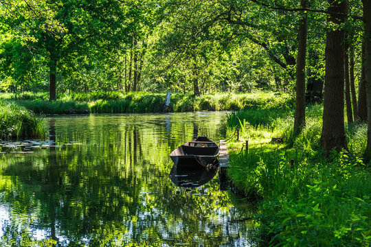 Water canal in the Spreewald Biosphere Reserve in Germany, with one of the typical wooden boats.