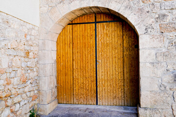 Fototapeta na wymiar gate home portal of classical entrance arch door house luxury restored stones facade
