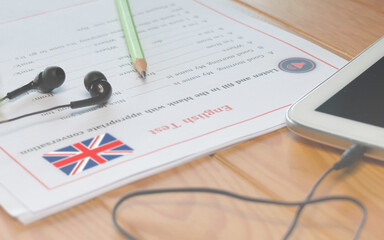 English listening test on wooden desk