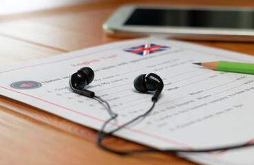 English listening test on wooden desk