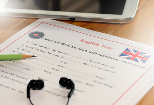 English listening test on wooden desk