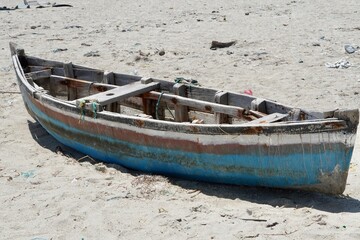 Fototapeta na wymiar old fishing boat on beach