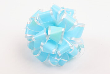 Blue ribbons with bows on a white background