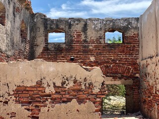 Ruins of the ancient town. Ruins of ancient architecture against blue sky background at summer season. Remains of building affected by super cyclone that struck the coastal area of Dhanushkodi. - Powered by Adobe