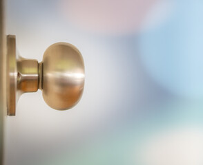Close Up of Golden Doorknob Against Bright Lights of Opportunity with Copy Space and Selective Focus