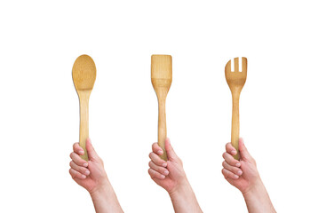 hand holding wooden spoon