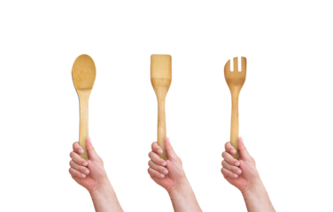 hand holding wooden spoon