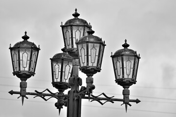 Fototapeta na wymiar Street lights in the old style on an autumn day