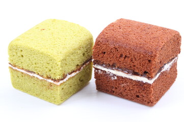 Brownie cheese cake and green tea cake on white background