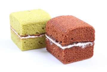 Brownie cheese cake and green tea cake on white background