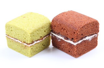Brownie cheese cake and green tea cake on white background