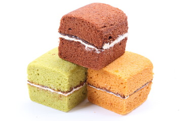 Brownie cheese cake and green tea cake on white background