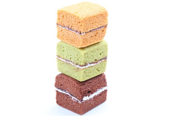 Brownie cheese cake and green tea cake on white background