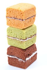 Brownie cheese cake and green tea cake on white background