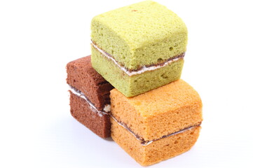 Brownie cheese cake and green tea cake on white background