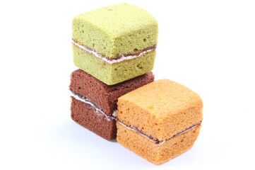 Brownie cheese cake and green tea cake on white background
