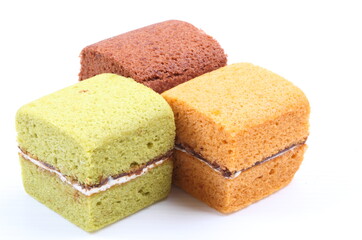 Brownie cheese cake and green tea cake on white background