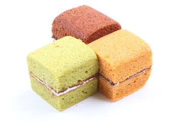 Brownie cheese cake and green tea cake on white background