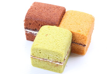 Brownie cheese cake and green tea cake on white background