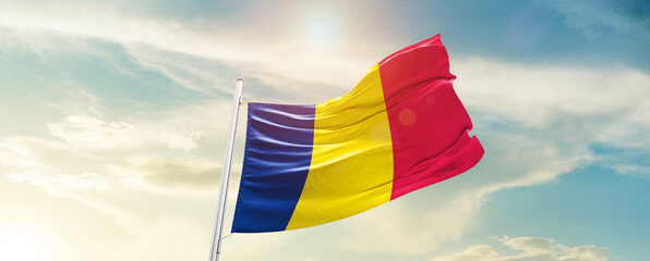 Chad national flag cloth fabric waving on the sky - Image