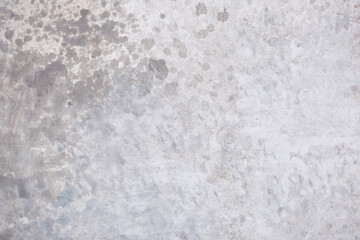 Light background of decorative plaster with abstract spots. Unusual texture of white or gray wall with beautiful patterns, creative surface background. Finishing coating for building cladding.