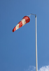 red and white windsock to indicate the direction of the air flow