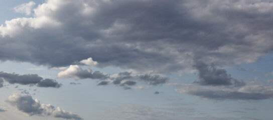 Naklejka na ściany i meble Dramatic black cloud before rainy. Beautiful cloudscape over horizon, sky