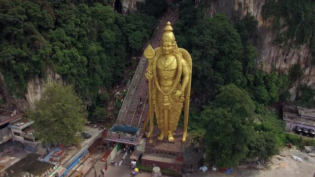 Aerial view of Lord Murugan statue at the entrance of the popular Batu Caves near Kuala Lumpur, Malaysia, one of the most important Hindu shrines outside of India.