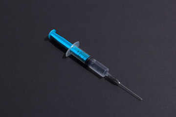 Disposable plastic syringe prepared for injection and vaccination in the hospital. The concept of...