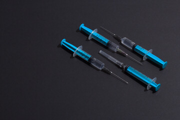 Fototapeta premium Disposable plastic syringe prepared for injection and vaccination in the hospital. The concept of medicine and health