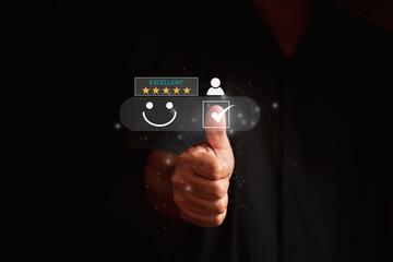 Customer service and Satisfaction , Men people are touching the virtual screen on the happy Smiley face icon to give satisfaction in service. giving five star rating concept.