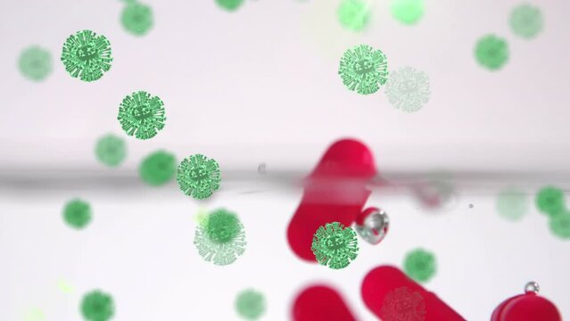 Animation of floating macro Covid-19 cells over falling pills into water