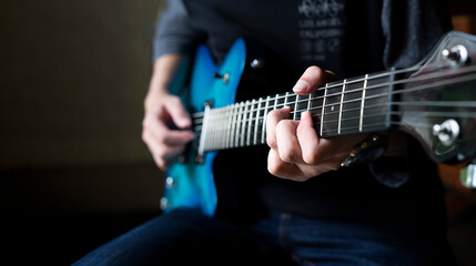 guitarist man playing guitar, a man sitting and practicing electric guitar with copy space for text