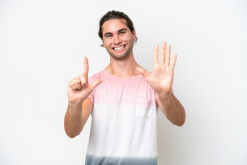 Caucasian handsome man isolated on white background counting seven with fingers