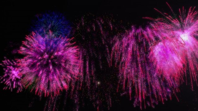 Animation of shooting star over colorful fireworks exploding against black background
