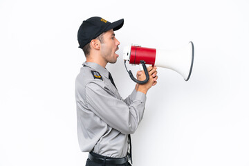 Young safeguard man over isolated white background shouting through a megaphone