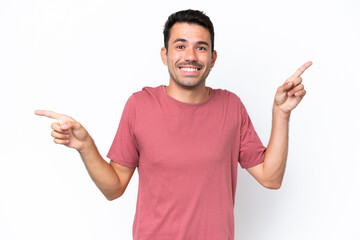 Young handsome man over isolated white background pointing finger to the laterals and happy