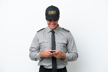 Young caucasian security man isolated on white background sending a message with the mobile