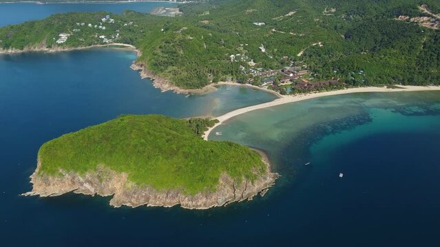 Koh Phangan, Thailand: Aerial drone footage of the famous Haad Mae beach and the sandbar in Ko Phan Ngan island in the gulf of Thailand. Shot with a tilt up and rotation motion. 