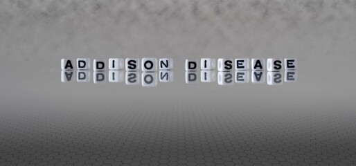 addison disease word or concept represented by black and white letter cubes on a grey horizon...
